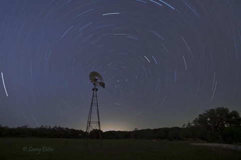 Star trails behind the old windmill right outside the front door.