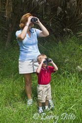 Mother teaching son about birding, s. Texas.