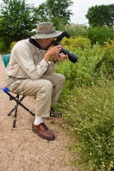 John Rosford of Ingram, Texas photographing butterflies at the NABA (North American Butterfly Association) butterfly park in Mission, Texas