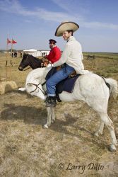 Scott McMahon, riding a white horse and dressed as one of Sam Walker's Texas Rangers of the 1840's at the Palo Alto Battle re-enactment, Palo Alto Battlefield National Historic Site, Texas. Walker's "rangers" were among the first to have revolver pistols on the Texas frontier.