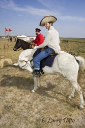 Scott McMahon, riding a white horse and dressed as one of Sam Walker's Texas Rangers of the 1840's at the Palo Alto Battle re-enactment, Palo Alto Battlefield National Historic Site, Texas. Walker's "rangers" were among the first to have revolver pistols on the Texas frontier.