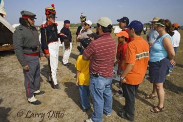 Actors dressed as Mexican soldiers share the Mexican perspecitive about the Battle of Palo Alto with visitors during a reenactment at the Palo Alto National Historic Site near Brownsville, Texas.