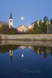 Full moon rising behing Our Lady of Refuge Parish Church on the historic Roma Plaza. The Roma Bluffs World Birding Center is on the south side of the plaza in another histoic building.