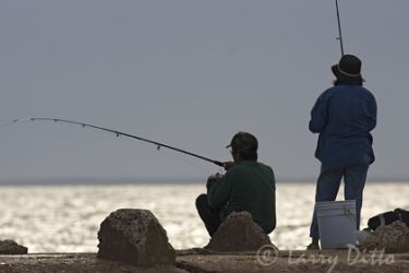 Fishing from jetty, Brownsville Ship Channel, Texas