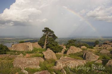 Rainbow and storm clouds seen from Mount Scott, Wichita Mountains National Wildlife Refuge, Oklahoma, June