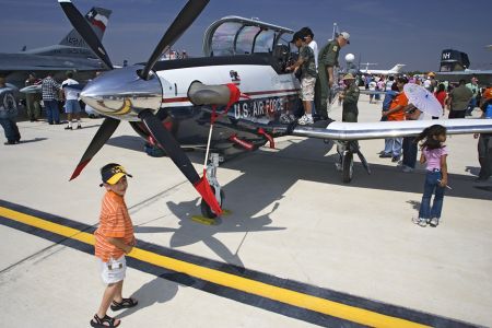 Kids love the Commerative Air Force Air Fiesta in Brownsville, Texas because they can climb right up by the cockpit and talk to real pilots.