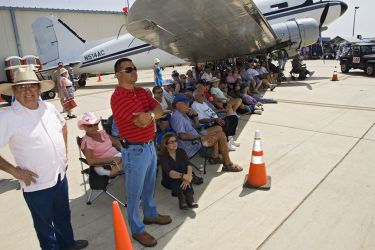 What better place to watch an air show on a warm spring day than from the shadow of a huge aircraft. The Commerative Air Force Air Fiesta in Brownsville, Texas attracts thousands of enthusiastic viewers to the Brownsville Air Port each spring.