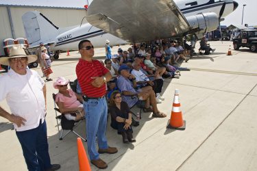 What better place to watch an air show on a warm spring day than from the shadow of a huge aircraft. The Commerative Air Force Air Fiesta in Brownsville, Texas attracts thousands of enthusiastic viewers to the Brownsville Air Port each spring.