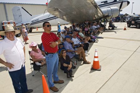 What better place to watch an air show on a warm spring day than from the shadow of a huge aircraft. The Commerative Air Force Air Fiesta in Brownsville, Texas attracts thousands of enthusiastic viewers to the Brownsville Air Port each spring.