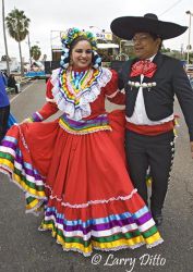 Dancers in "Grupo Folklorico de Tizatlan" represent the University of Texas - Brownsville and Texas Southmost College at the Charro Days Festival street dance in Brownsville, Texas