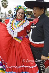 Dance troop "Grupo Folklorico Tizatlan" represent the University of Texas - Brownsville and Texas Southmost College at the Charro Days street dance in Brownsville, Texas. The group entertains the crowds with the folk dances and music of old south Texas and northeast Mexico, all done in traditional Charro fiesta attire.