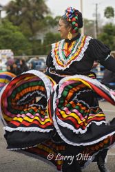 Dance troop "Grupo Folklorico Tizatlan" represent the University of Texas - Brownsville and Texas Southmost College at the Charro Days street dance in Brownsville, Texas. The group entertains the crowds with the folk dances and music of old south Texas and northeast Mexico, all done in traditional Charro fiesta attire.