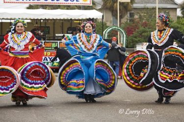Dance troop "Grupo Folklorico Tizatlan" represent the University of Texas - Brownsville and Texas Southmost College at the Charro Days street dance in Brownsville, Texas. The group entertains the crowds with the folk dances and music of old south Texas and northeast Mexico, all done in traditional Charro fiesta attire.