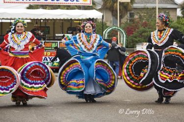Dance troop "Grupo Folklorico Tizatlan" represent the University of Texas - Brownsville and Texas Southmost College at the Charro Days street dance in Brownsville, Texas. The group entertains the crowds with the folk dances and music of old south Texas and northeast Mexico, all done in traditional Charro fiesta attire.