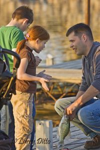 Father and daughter talking fishing