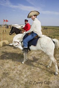 Scott McMahon, riding a white horse and dressed as one of Sam Walker's Texas Rangers of the 1840's at the Palo Alto Battle re-enactment, Palo Alto Battlefield National Historic Site, Texas. Walker's "rangers" were among the first to have revolver pistols on the Texas frontier.