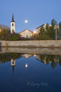 Full moon rising behing Our Lady of Refuge Parish Church on the historic Roma Plaza. The Roma Bluffs World Birding Center is on the south side of the plaza in another histoic building.