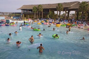 Rio Beach has plenty of shaded seating under a giant "palapa", a gentlly sloped beach with breaking surf. It is the starting point for the Rio Aventura tubing area.